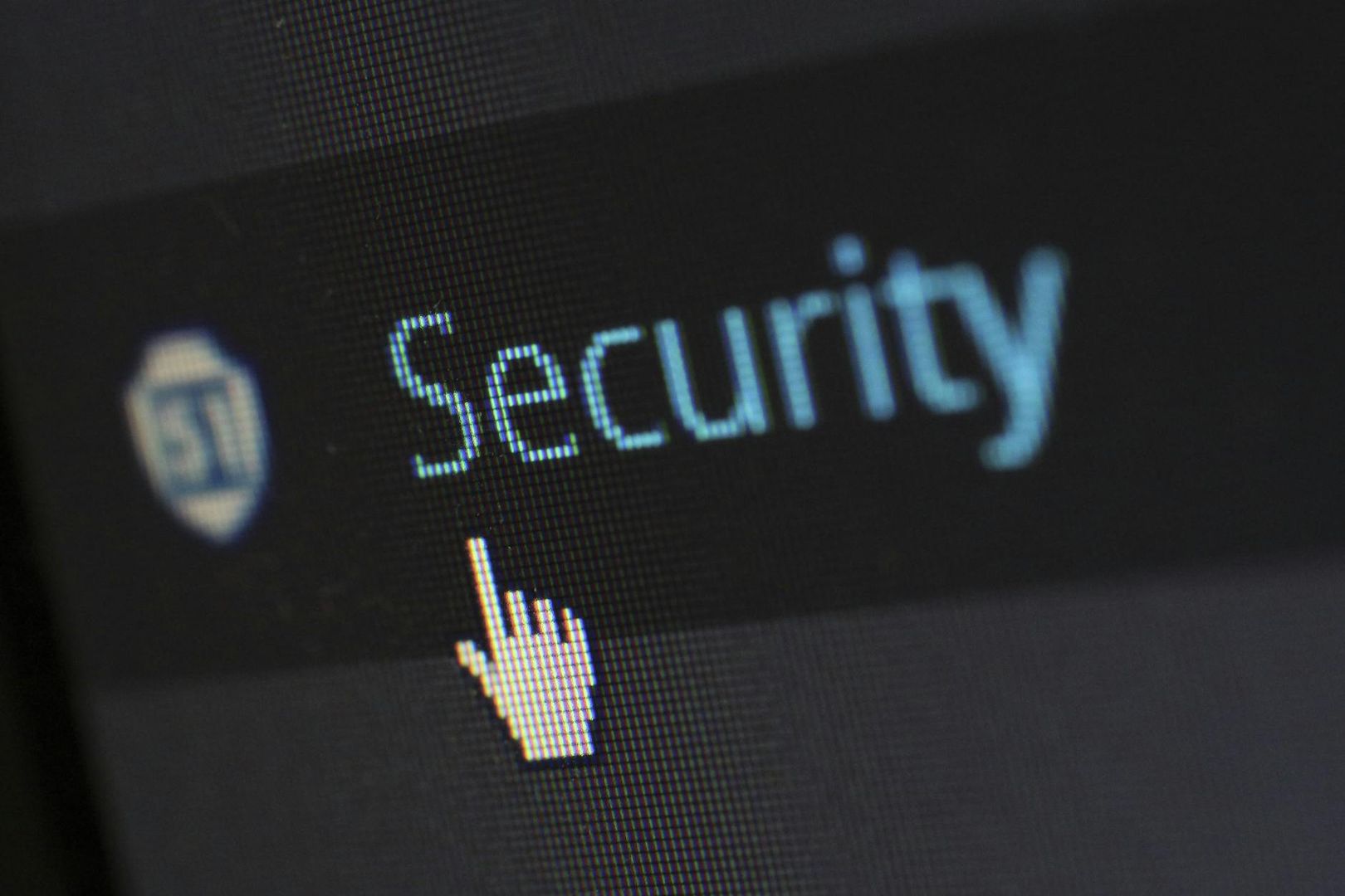Dataskärm med ordet "Security" och en muspekare som indikerar ett klick.